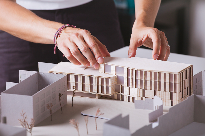 man creating model of a building