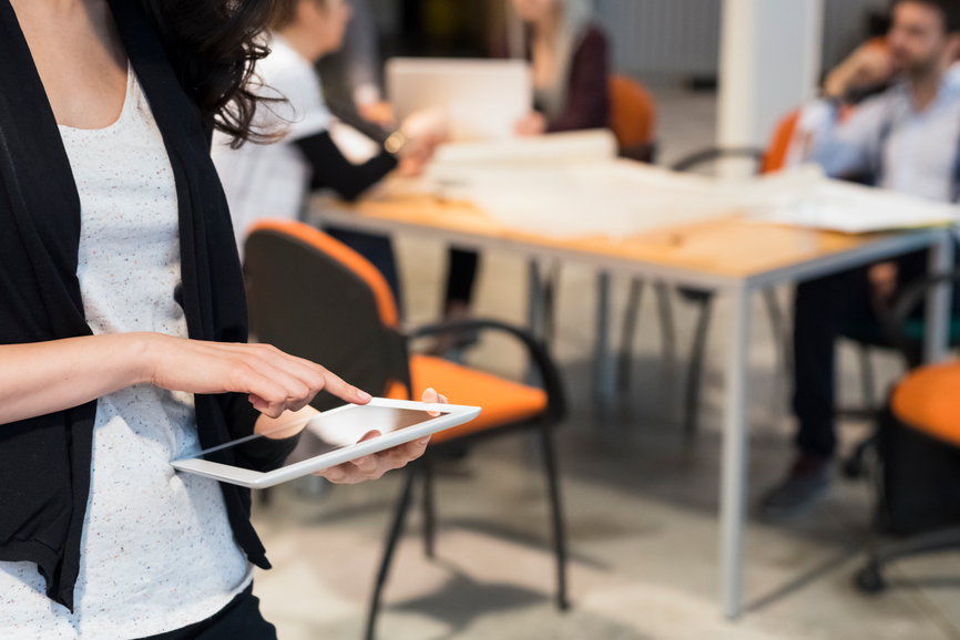 woman looking at ipad